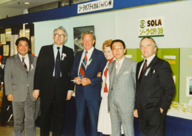 R to L:  Bob Pearson, Benny Sato, Ali Roscrow, Noel Roscrow, Dennis Oliver (a director of Pilkington Brothers Ltd and chairman of the Ophthalmic Division Board)